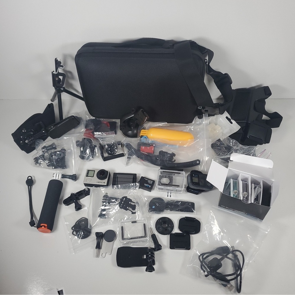 GoPro Hero4, Two Batteries, And Accessories Lot. Mounts, Body And Head Harness